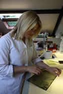 Laura cleaning a 16th century glass panel from our Strawberry Hill project.